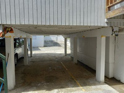 Parking Area 
The parking area under  the structure#2 lost its zinc roof during Hurricane Maria.  Therefore, this upper section is not in any use.
( El estacionamiento bajo techo de la estructura #2 perdió su techo de zinc durante huracán María,  Desde entonces, la parte superior no se usa para nada).
